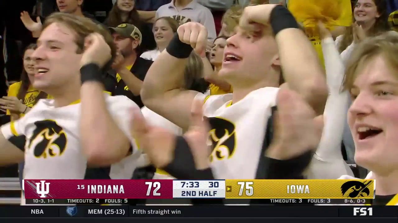 Kris Murray hits the shot inside and draws a foul as Iowa increases its lead over Indiana