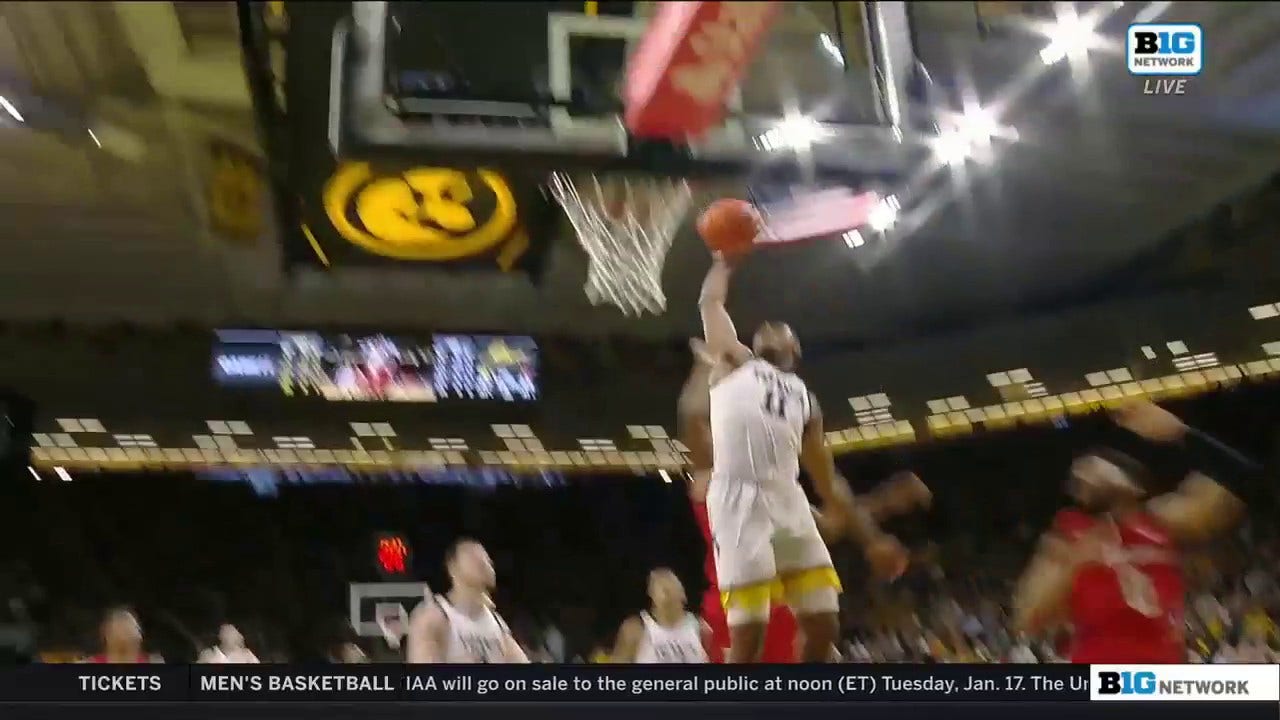 Tony Perkins throws down a vicious dunk to increase Iowa's second half lead