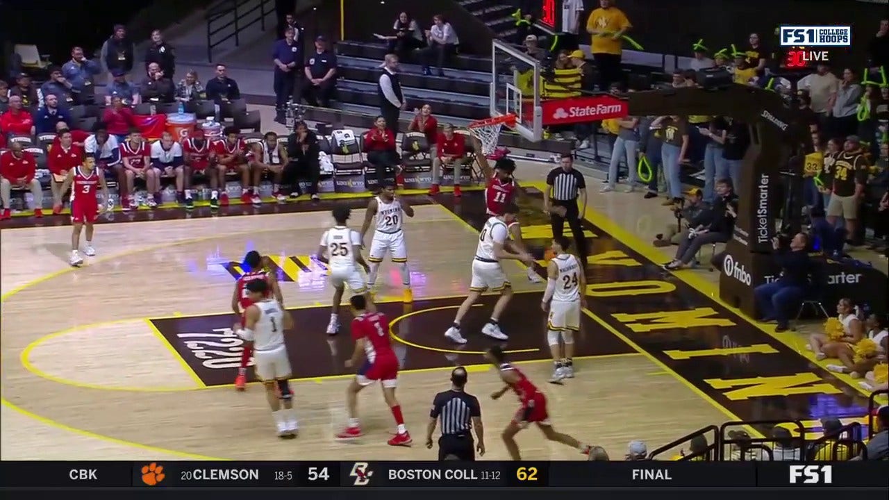 Fresno State's Isaih Moore makes a two-handed dunk over a Wyoming defender