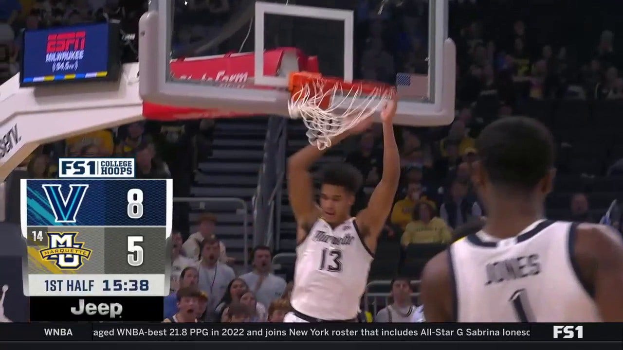 Marquette's Oso Ighodaro throws down a huge alley-oop dunk to trim into Villanova's lead