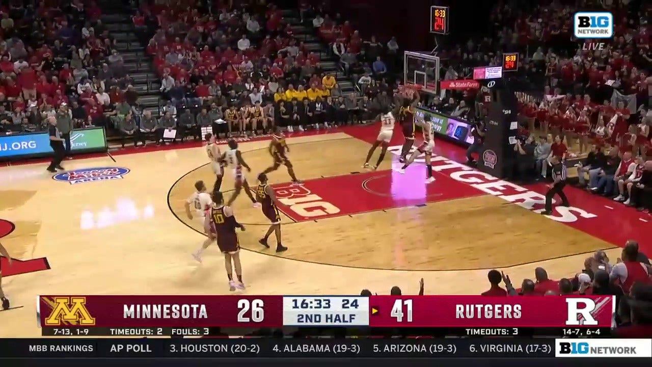 Minnesota's Joshua Ola-Joseph goes up strong and throws down a powerful two-handed dunk against Rutgers