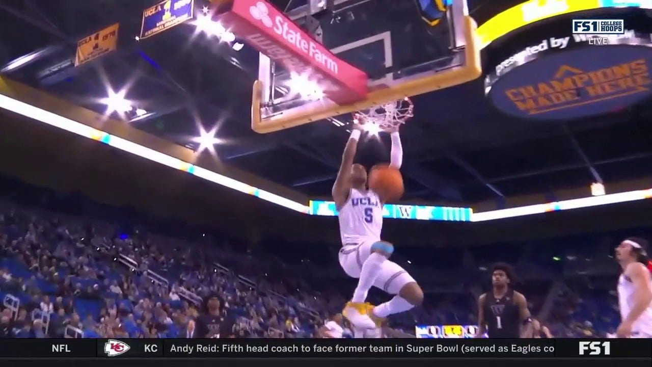 Jaylen Clark hammers in a powerful two-handed slam for UCLA to extend its lead vs. Washington