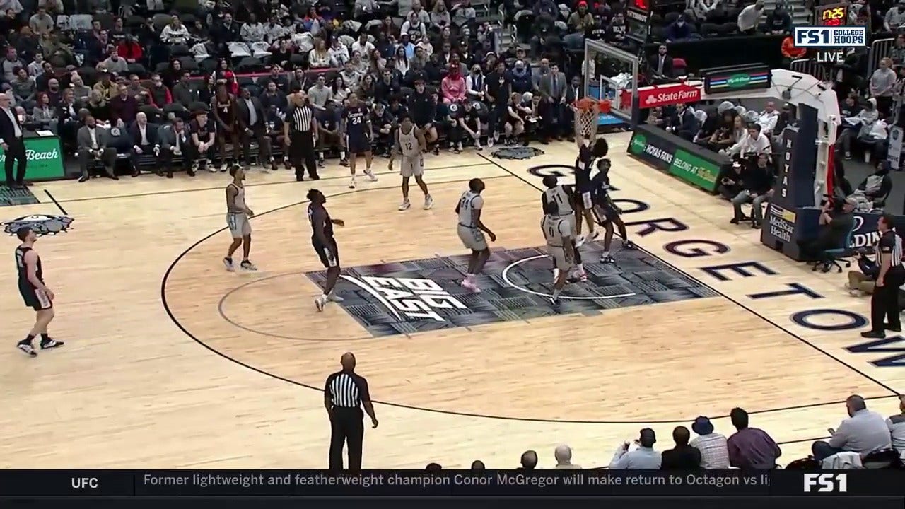 Andre Jackson Jr. rocks the rim after an alley-oop pass from Tristen Newton to give UConn the lead over Georgetown