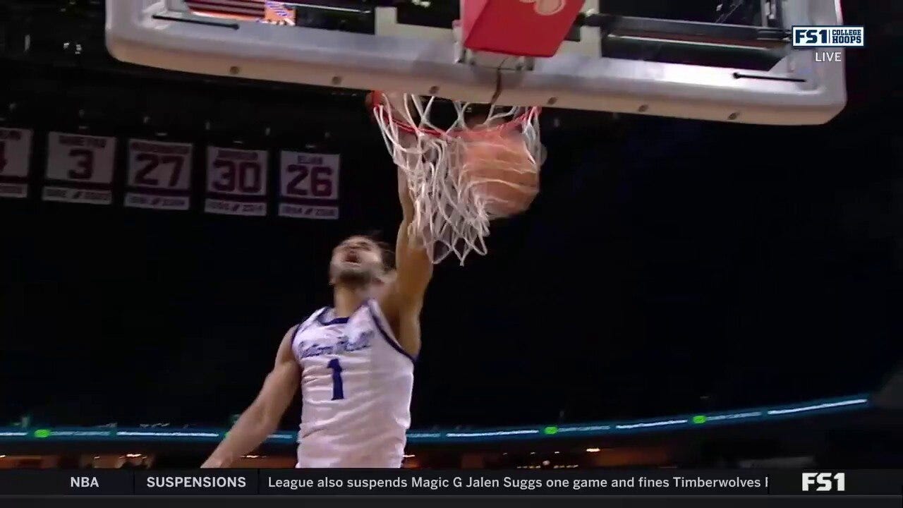 Seton Hall's Tray Jackson throws down a vicious dunk to trim into DePaul's lead