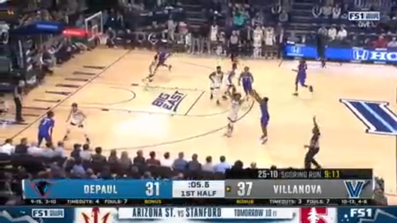 DePaul's Umoja Gibson hits a deep 3-pointer to trim VIllanova's lead heading into the half