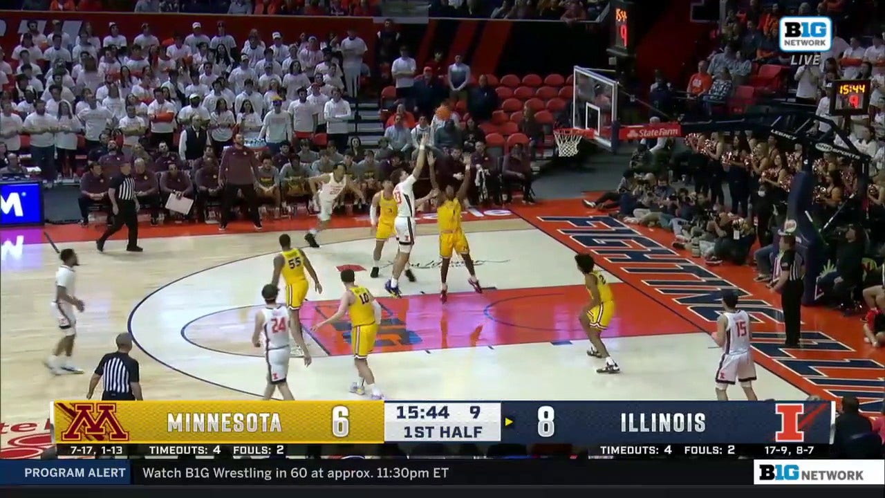 Illinois' Coleman Hawkins spins against the defense and sinks an effortless hook shot