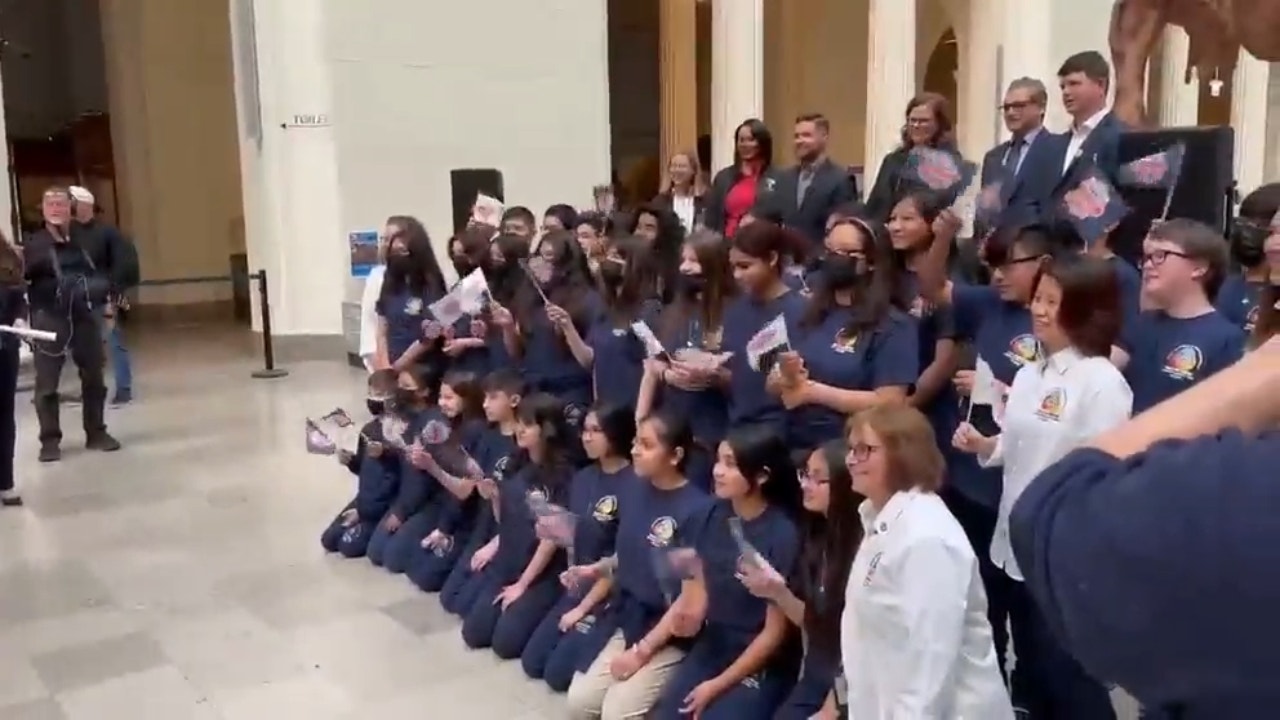 Ricky Stenhouse Jr. takes pictures with students from Chicago Public Schools