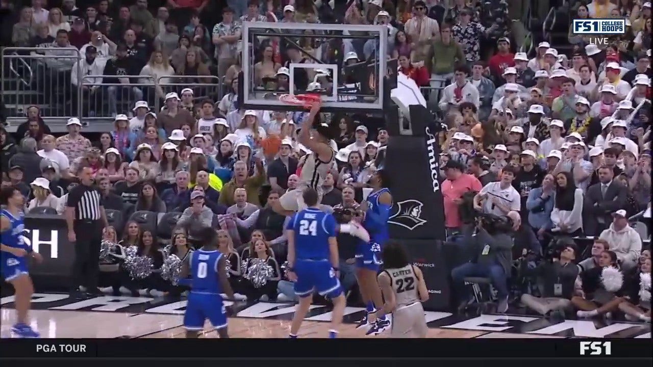 Providence's Ed Croswell trims the lead and throws down a smooth two-handed jam against Xavier