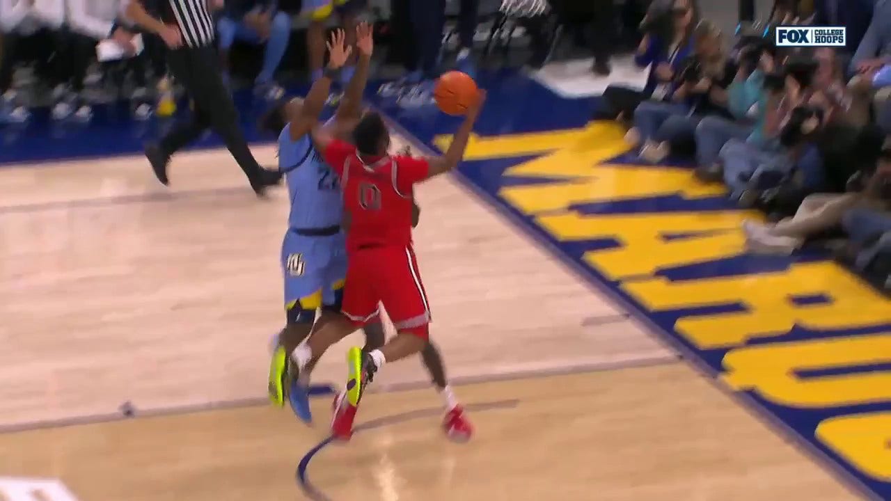 St. John's Posh Alexander makes a tough and-1 finish against Marquette