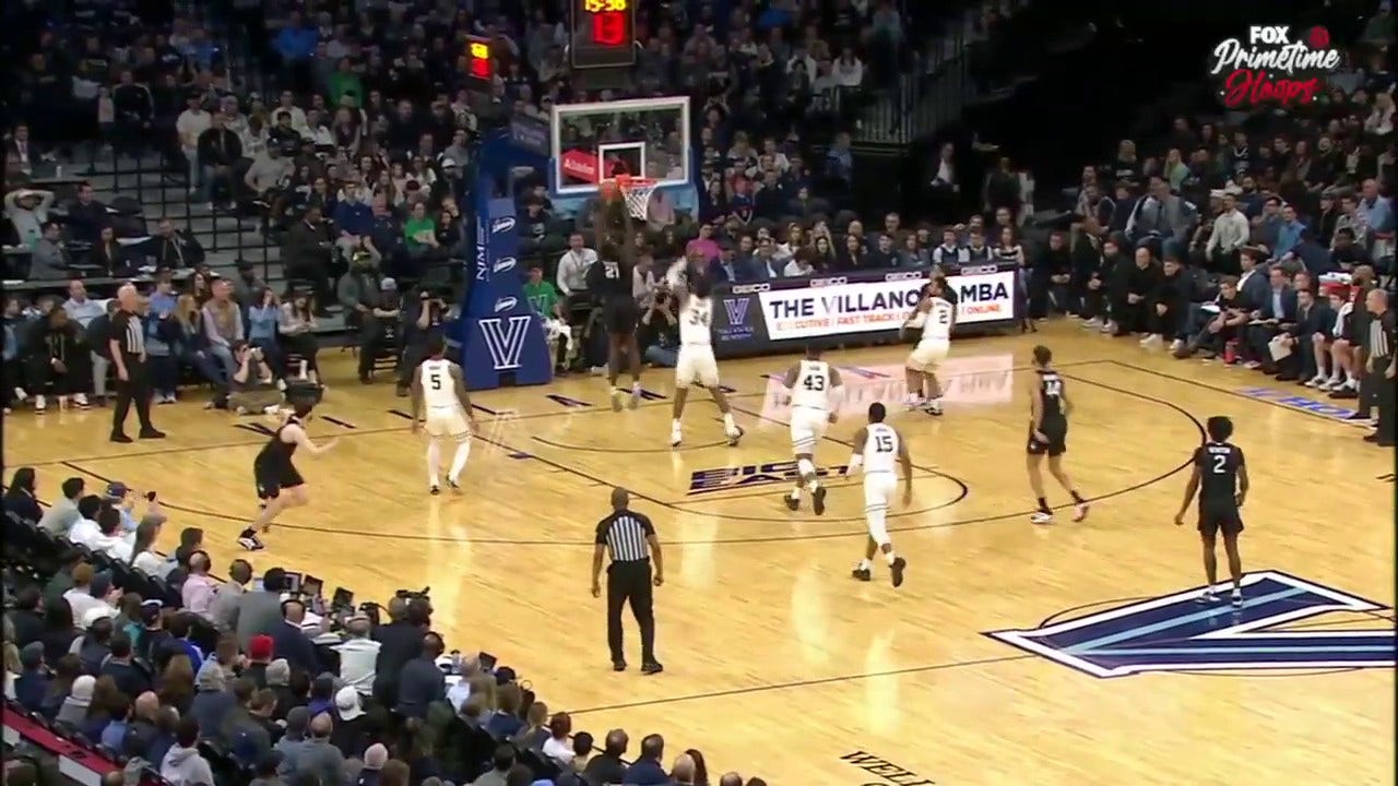 Adama Sanogo helps Uconn out to the early lead against Villanova after a big two-handed dunk