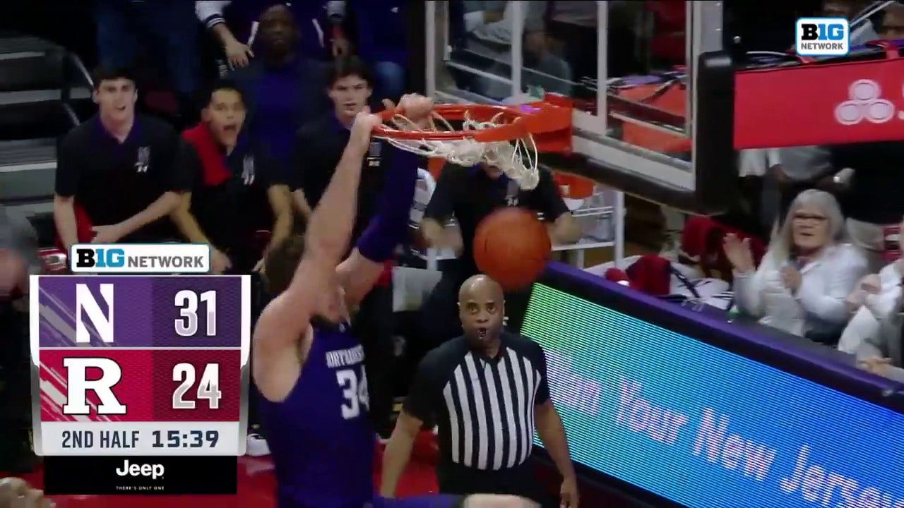 Northwestern's Matthew Nicholson throws down the two-handed put back slam to increase the second half lead over Rutgers