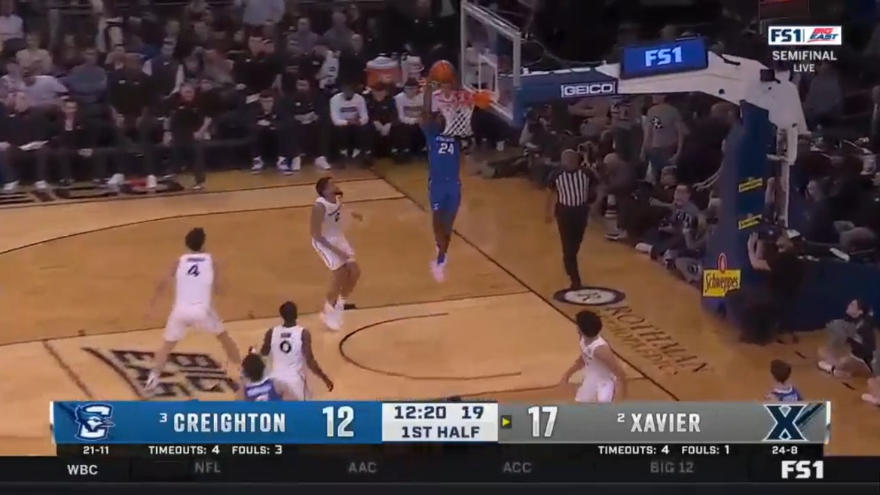 Creighton's Ryan Nembhard assists Arthur Kaluma on an alley-oop dunk over Xavier