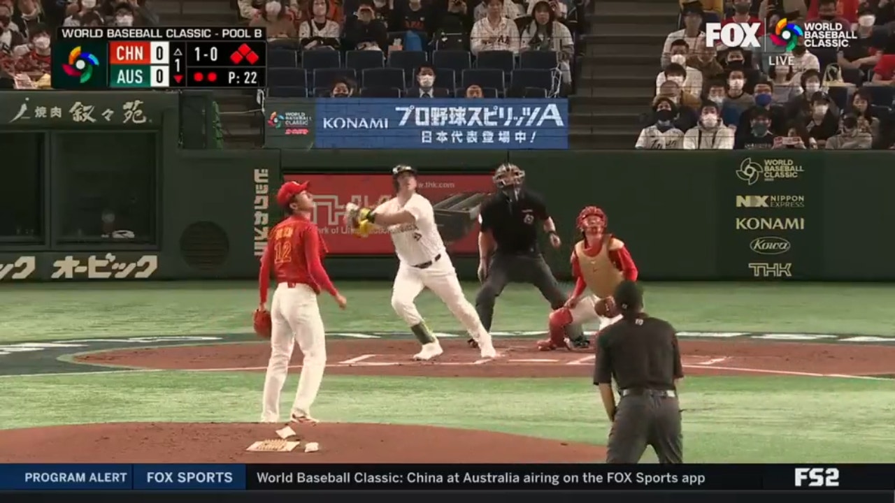 Australia's Rixon Wingrove smashes a two-out, bases-clearing double in the first inning against China