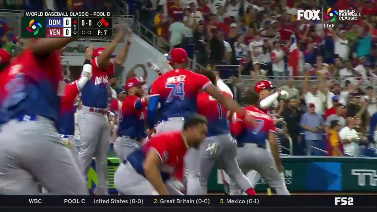 Dominican Republic's Juan Soto hits an RBI double to put his team on the board 1-0 over Venezuela