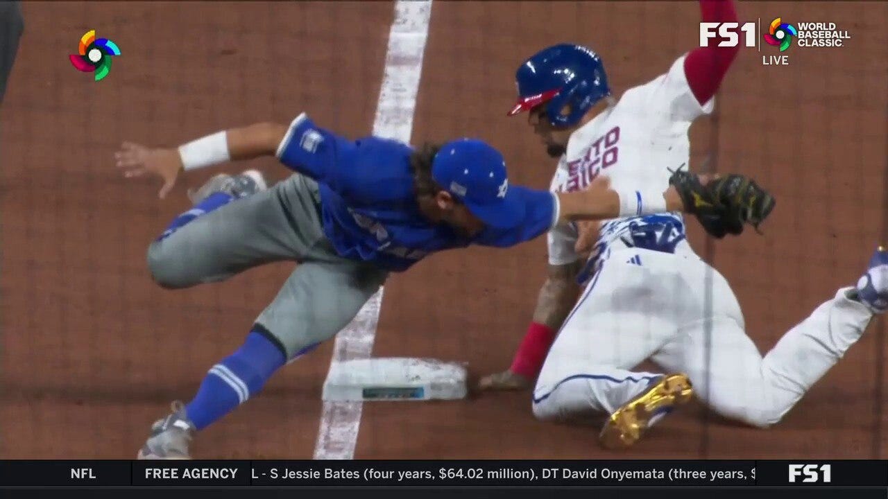 Puerto Rico's Javier Báez steals third base and magically avoids