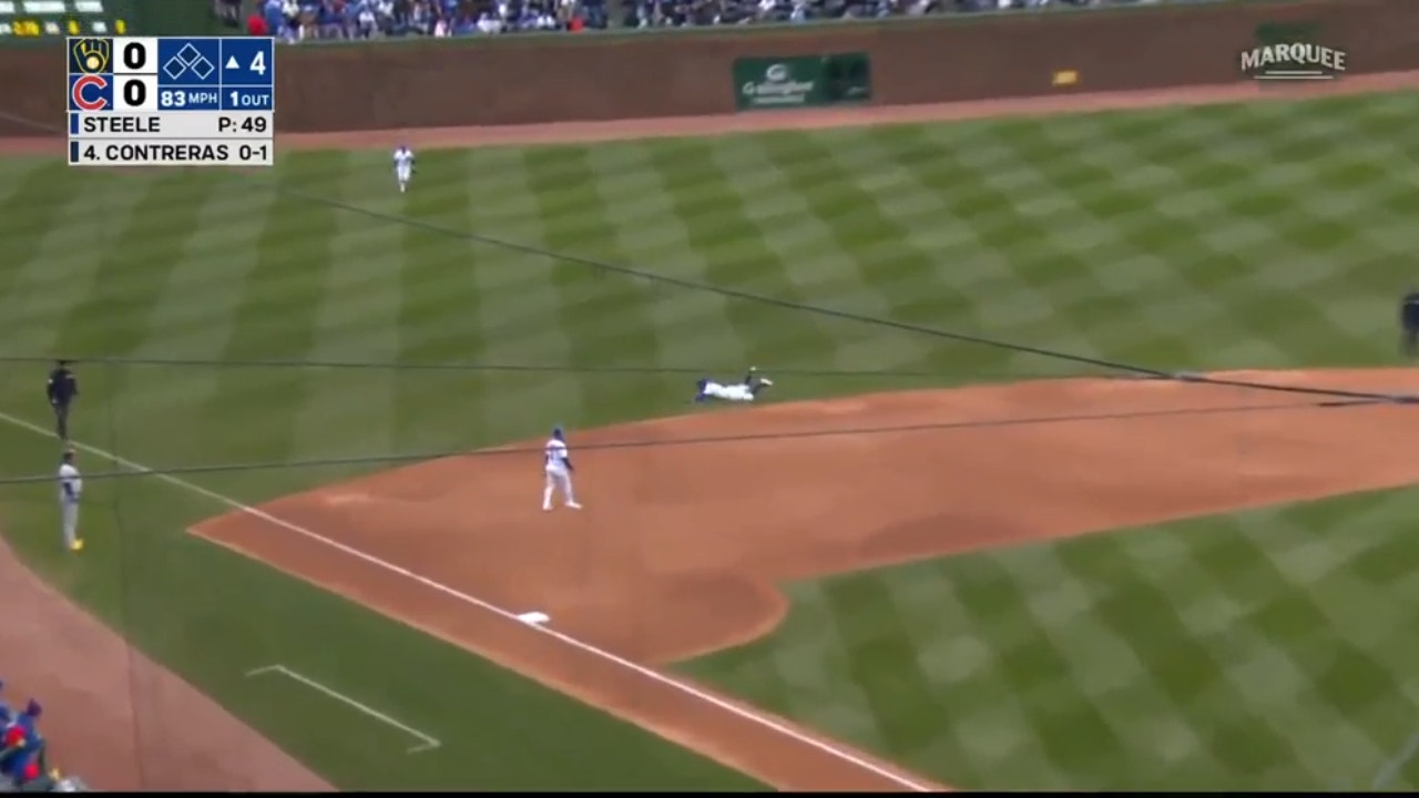 Cubs' Dansby Swanson makes a SPECTACULAR diving play and throw to get the runner at first