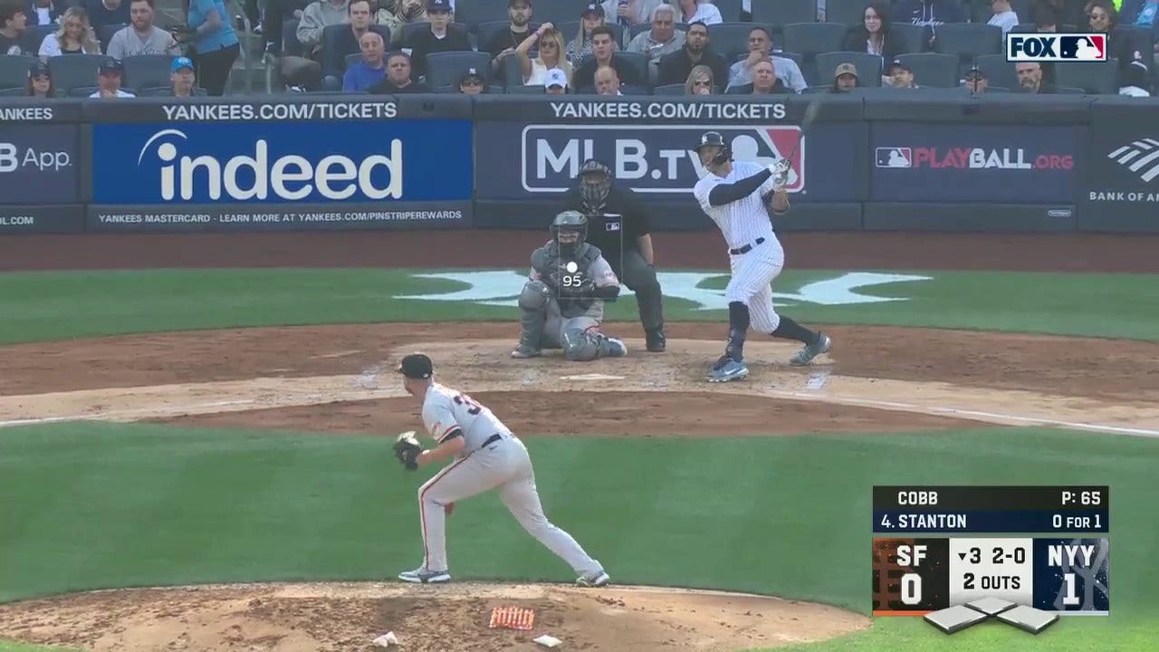 Yankees' Giancarlo Stanton smashes a home run to right field to take a 2-0 lead vs. Giants