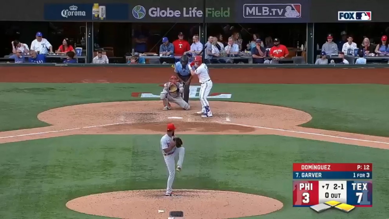 Mitch Garver slams a three-run homer to left field to extend the Rangers lead to 10-3 over the Phillies