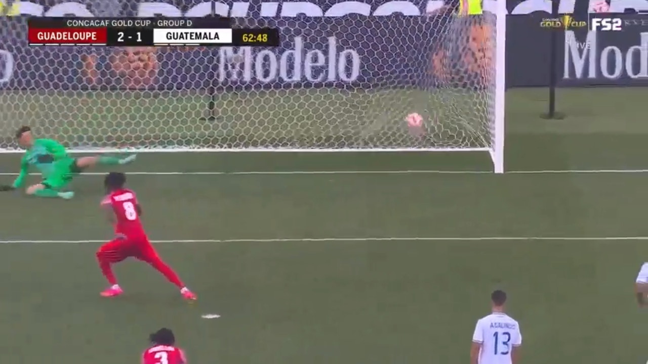 Guadeloupe's Ange-Freddy Plumain smashes in a goal against Guatemala