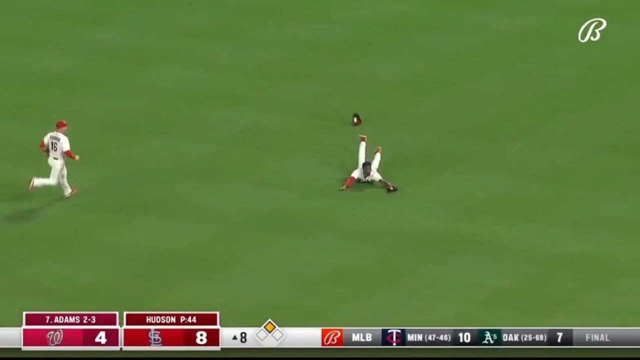 Cardinals' Jordan Walker lays out and makes a diving grab to rob Riley Adams of a base hit