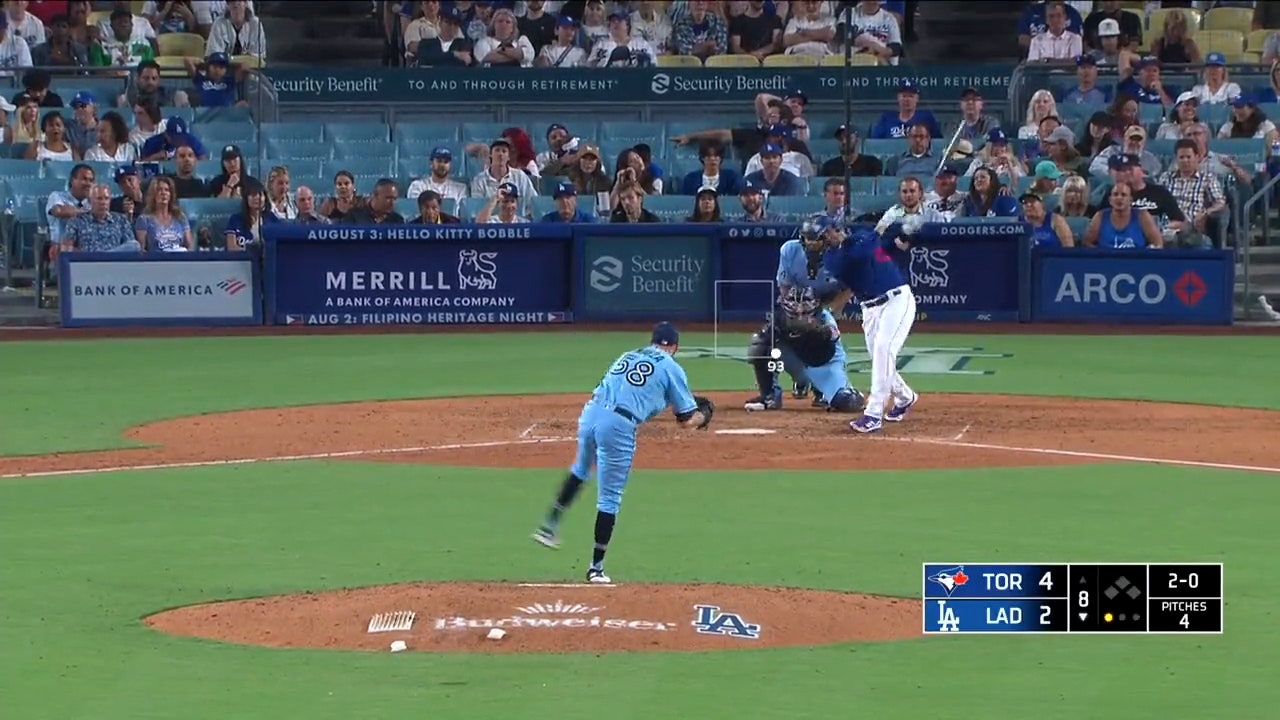 J.D. Martinez crushes a solo home run to left field to help the Dodgers trim the lead against the Blue Jays