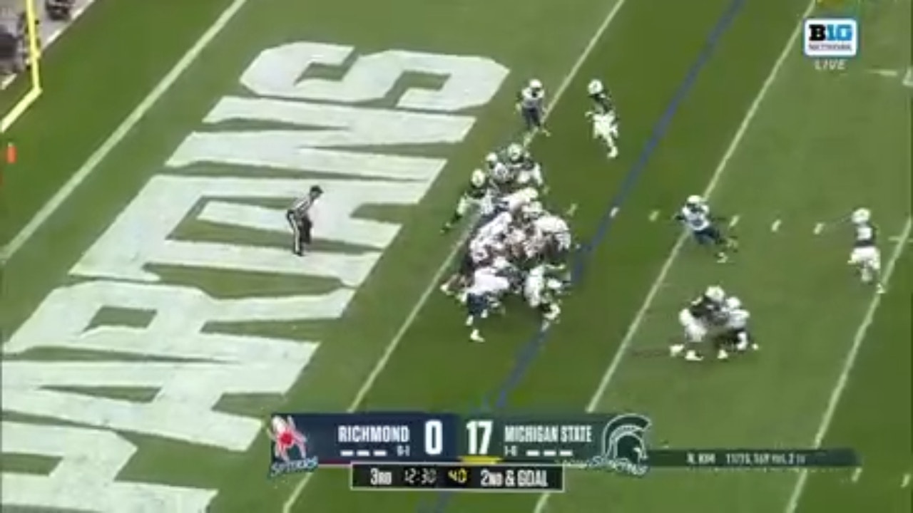 Nathan Carter punches in the touchdown extending Michigan State's lead against Richmond