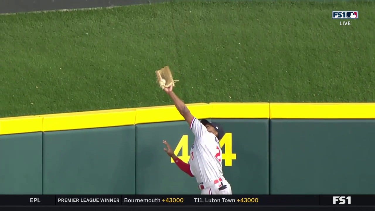 Twins' Michael A. Taylor makes a LEAPING catch to rob Reds' Will Benson of a three-run home run