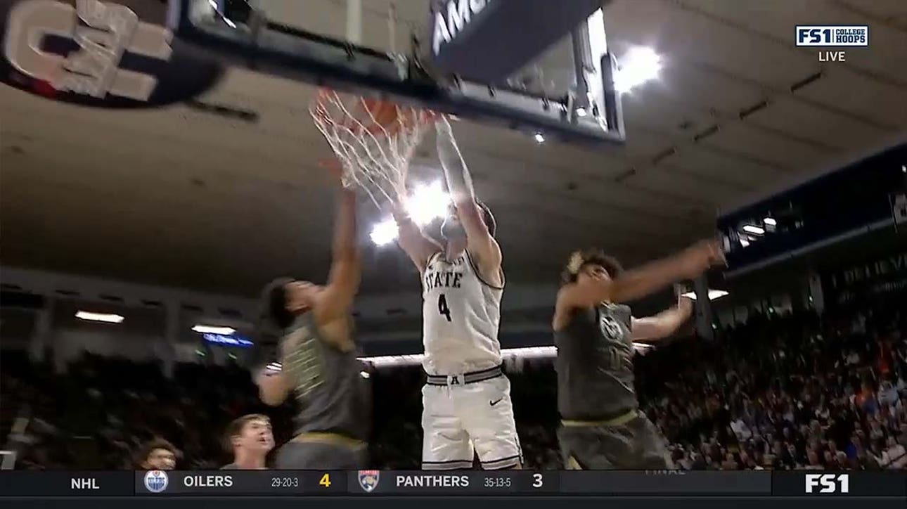 Utah State's Brandon Horvath throws down a two-handed dunk off a perfect pass from teammate Steven Ashworth