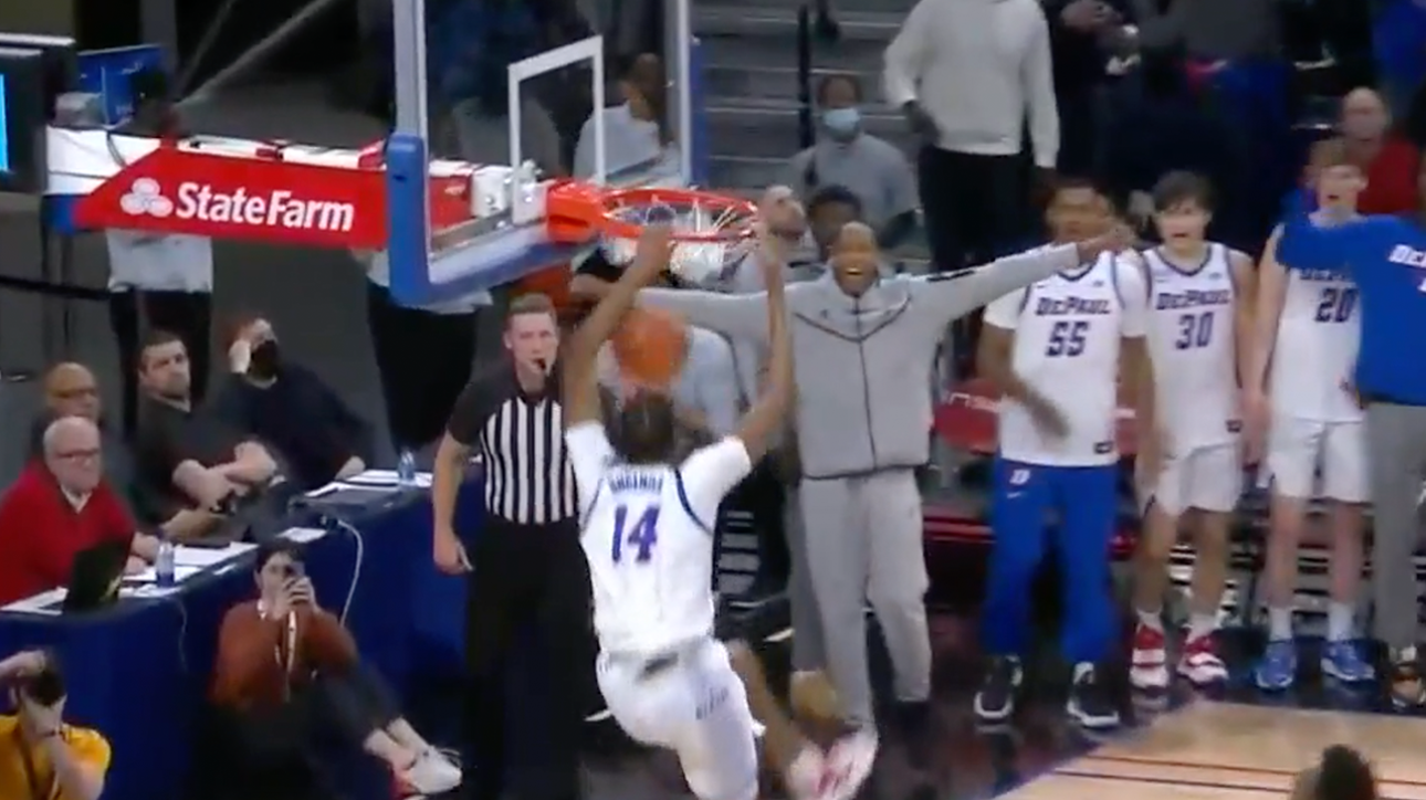 Nick Ongenda puts down the alley-oop jam as DePaul leads Marquette in the second half