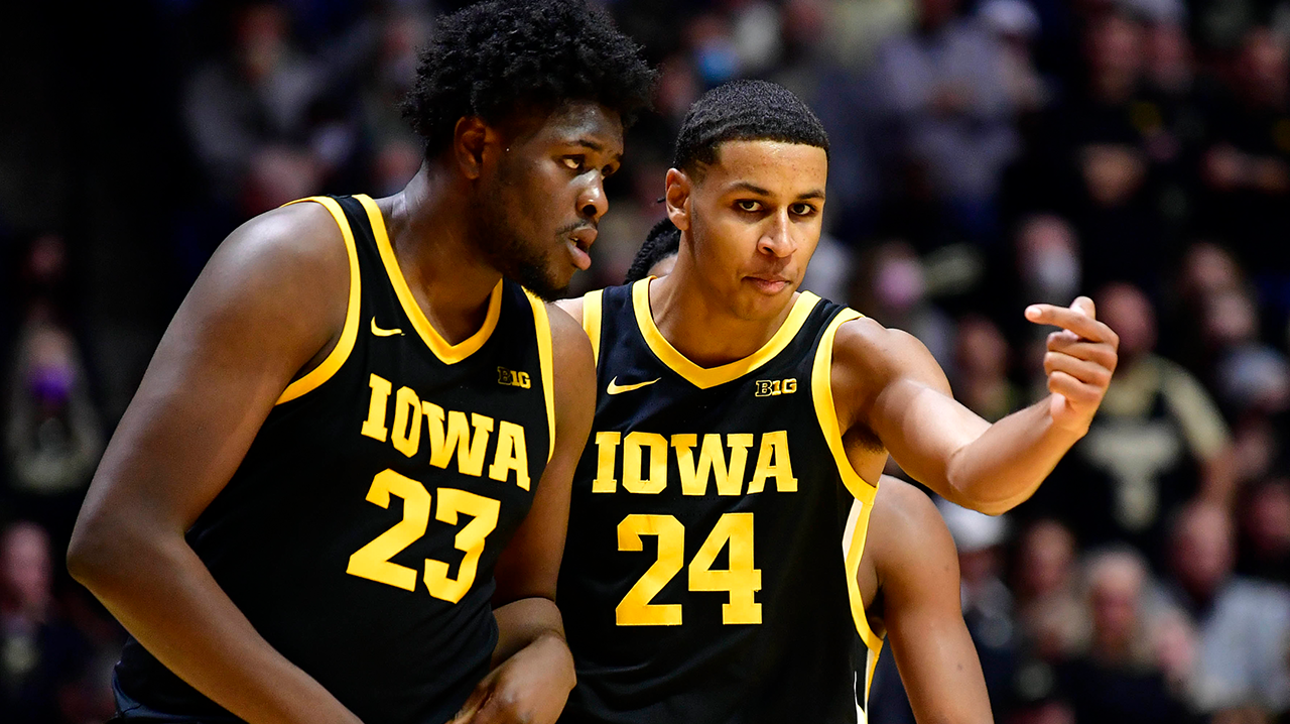 Kris Murray drives to the rim and throws down a slam plus contact that increases Iowa's lead