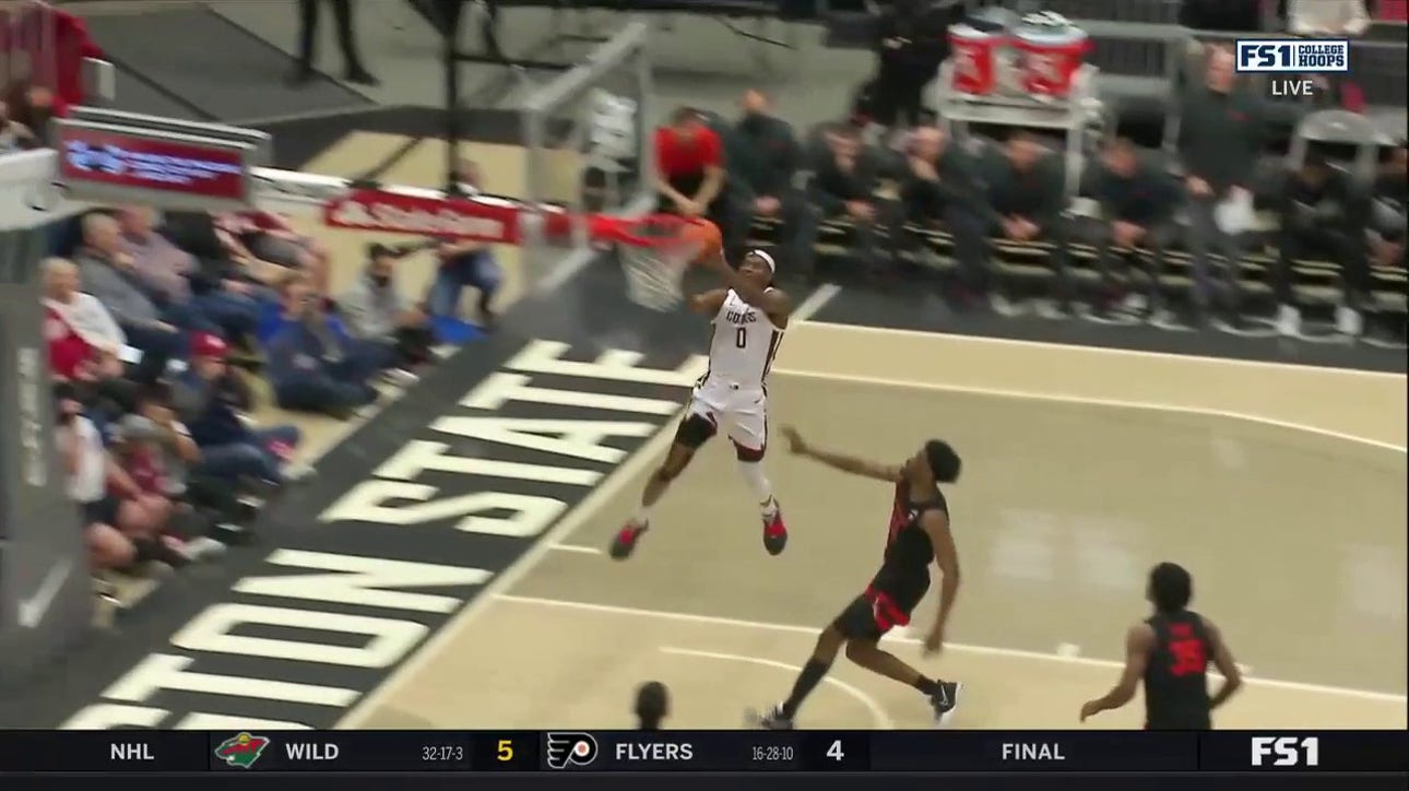 Washington State's Efe Abogidi finishes the wild alley-oop and then gets the monster swat