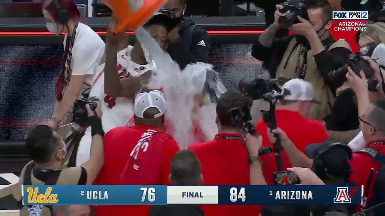 Dalen Terry gives Tommy Lloyd a Gatorade bath after Arizona wins the Pac-12 Championship