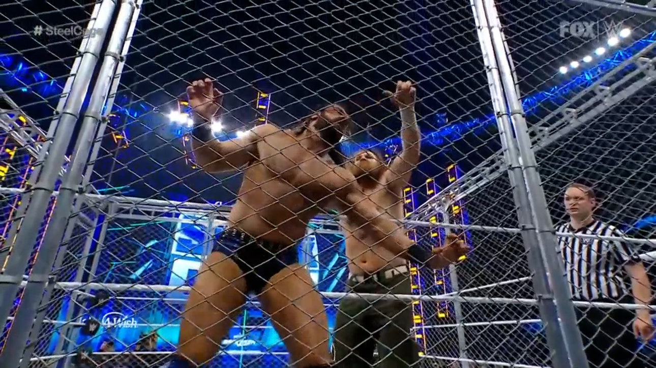 Sami Zayn is locked inside of a steel cage with Drew McIntyre to prevent his escape I WWE on FOX