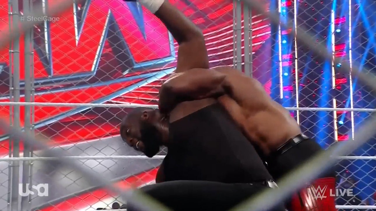 Bobby Lashley and Omos locked in a steel cage on Monday Night Raw I WWE on FOX