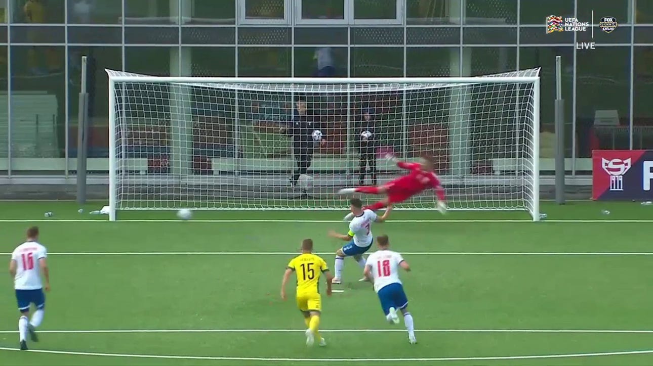 Viljormur Davidsen executes the penalty kick to perfection to bring Faroe Islands level, 1-1