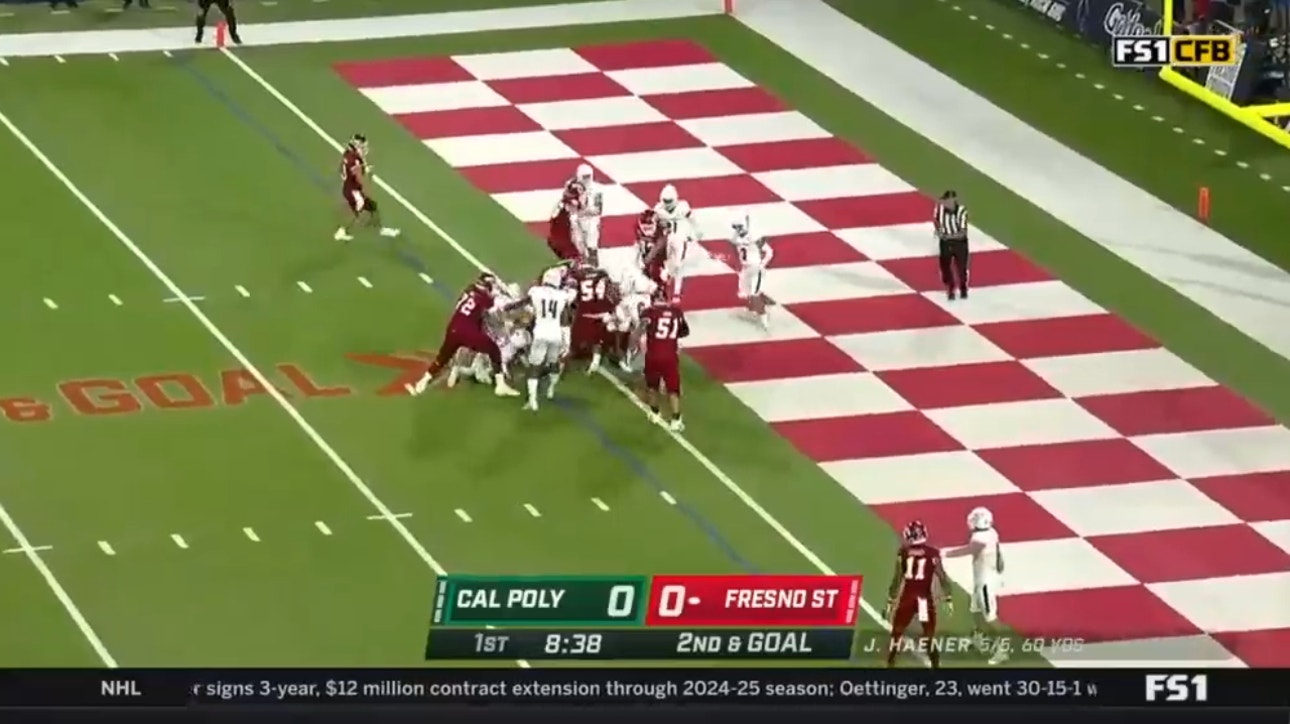 Fresno State's Jordan Mims punches it in for a one-yard touchdown to gain a 7-0 lead over Cal Poly
