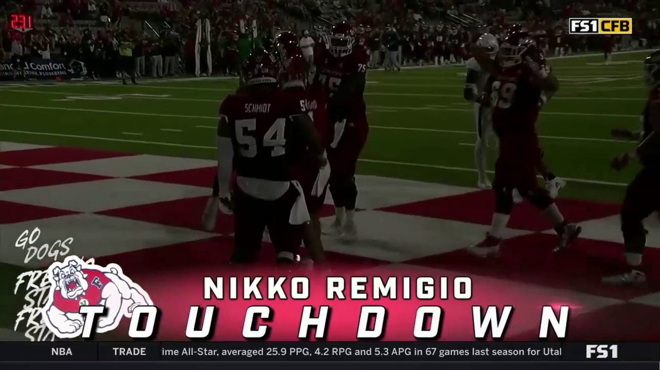 Fresno State's Nikko Remigio rushes for a 13-yard touchdown against Cal Poly