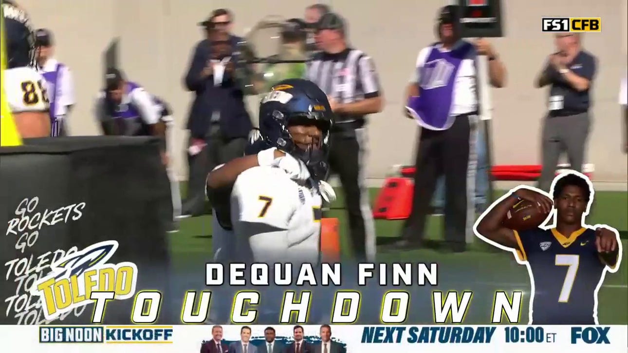 Toledo's quarterback Dequan Finn rushes in a one yard touchdown to take the lead 14-10