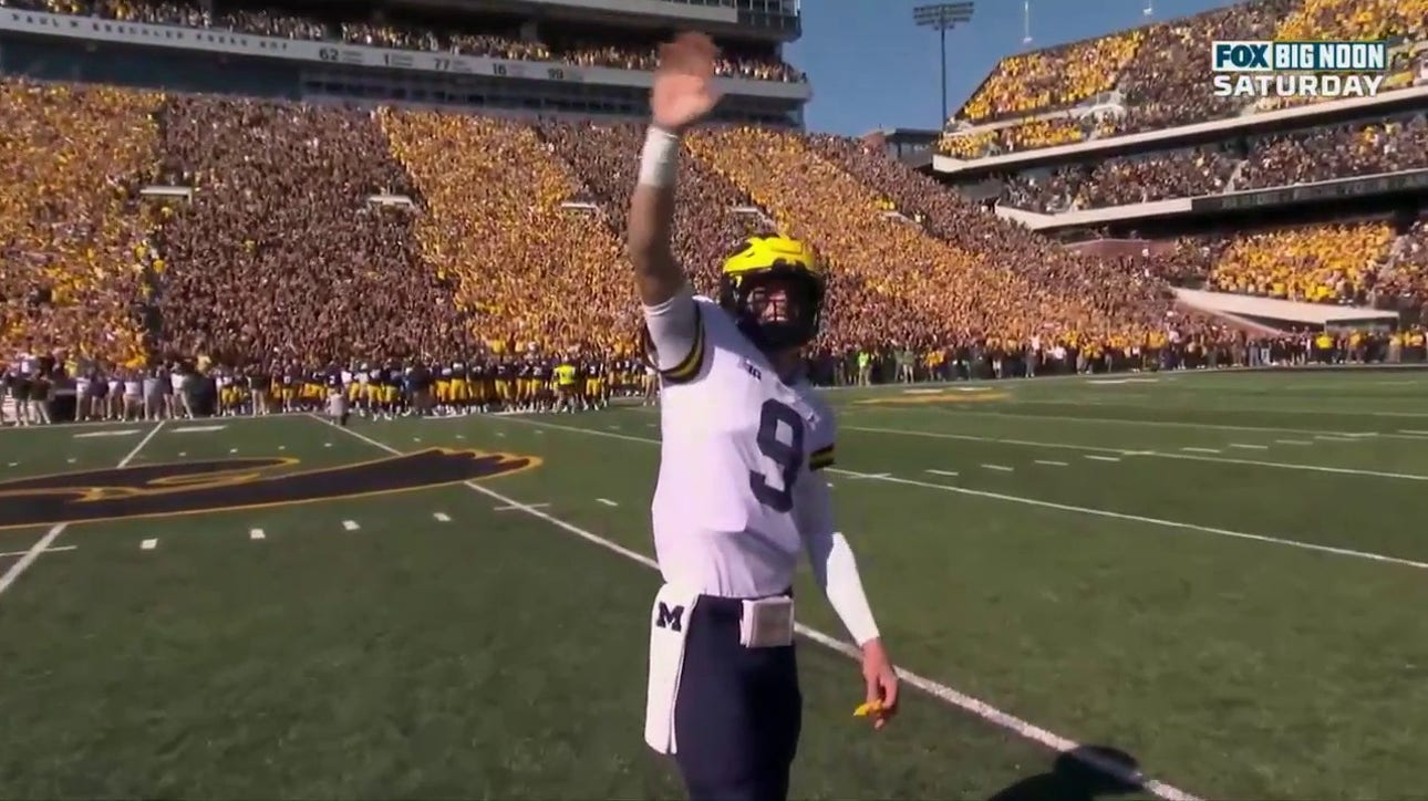 Iowa and Michigan participate in the 'Iowa wave' tradition 
