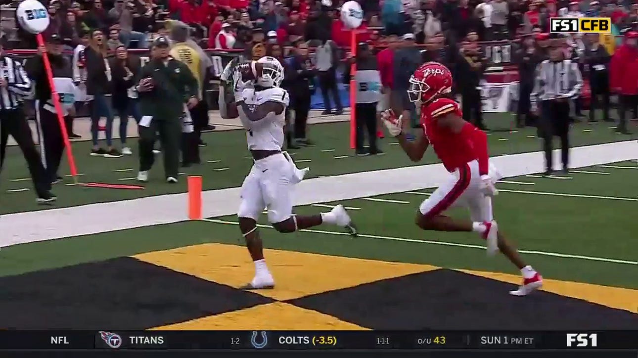 Jayden Reed secures the perfect ball from Payton Thorne as Michigan State pulls within one