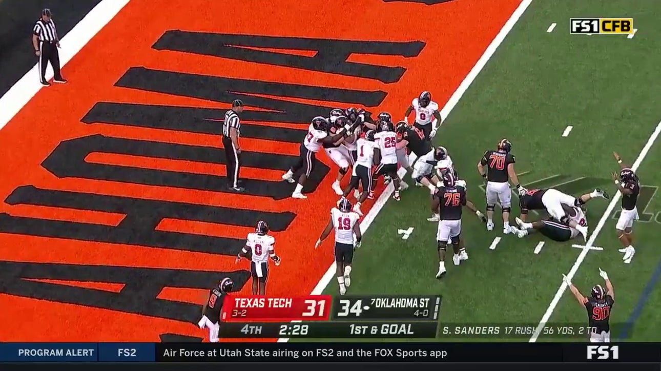 Dominic Richardson clinches the game after a seven-yard rushing TD for the Cowboys to beat Texas Tech, 41-31