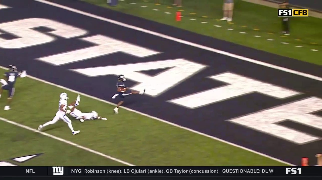 Utah State's Terrell Vaughn scores the 34-yard touchdown on the shovel pass from Cooper Legas