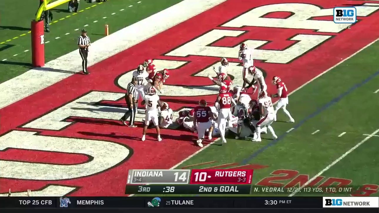 Rutgers’ Samuel Brown finds a hole in the defense for a two-yard rushing TD to take a 16-14 lead over Indiana