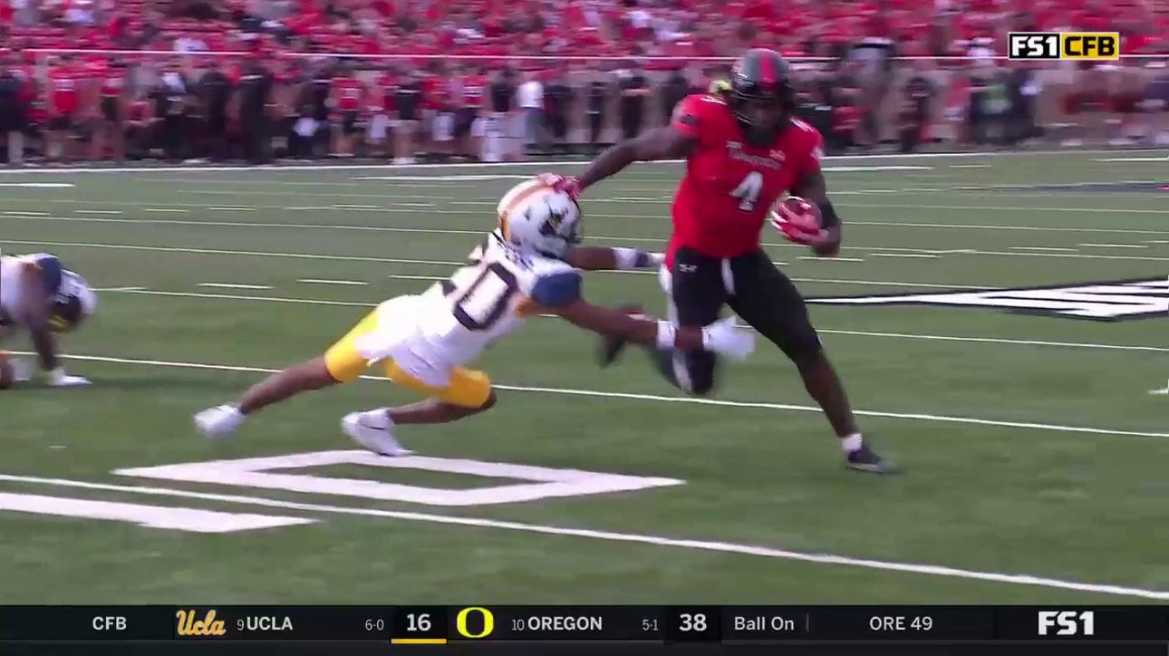 SaRodorick Thompson stiff arms a couple defenders on his way to another Texas Tech TD