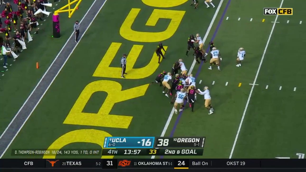 UCLA's Zach Charbonnet punches into the endzone for a one-yard TD