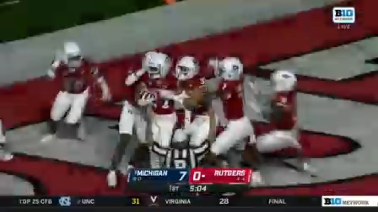 Rutgers' Max Melton blocks a punt, Timmy Ward scoops and scores against Michigan