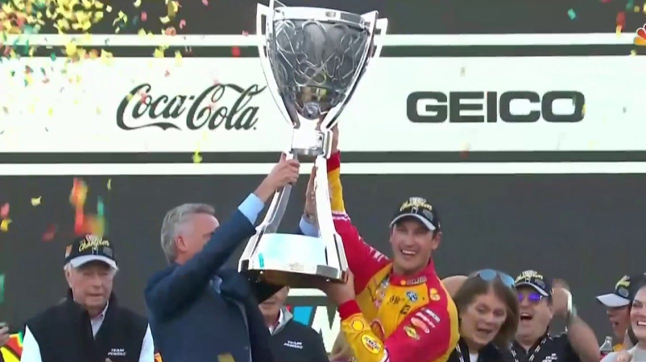 Joey Logano accepts the Bill France Cup Championship Trophy