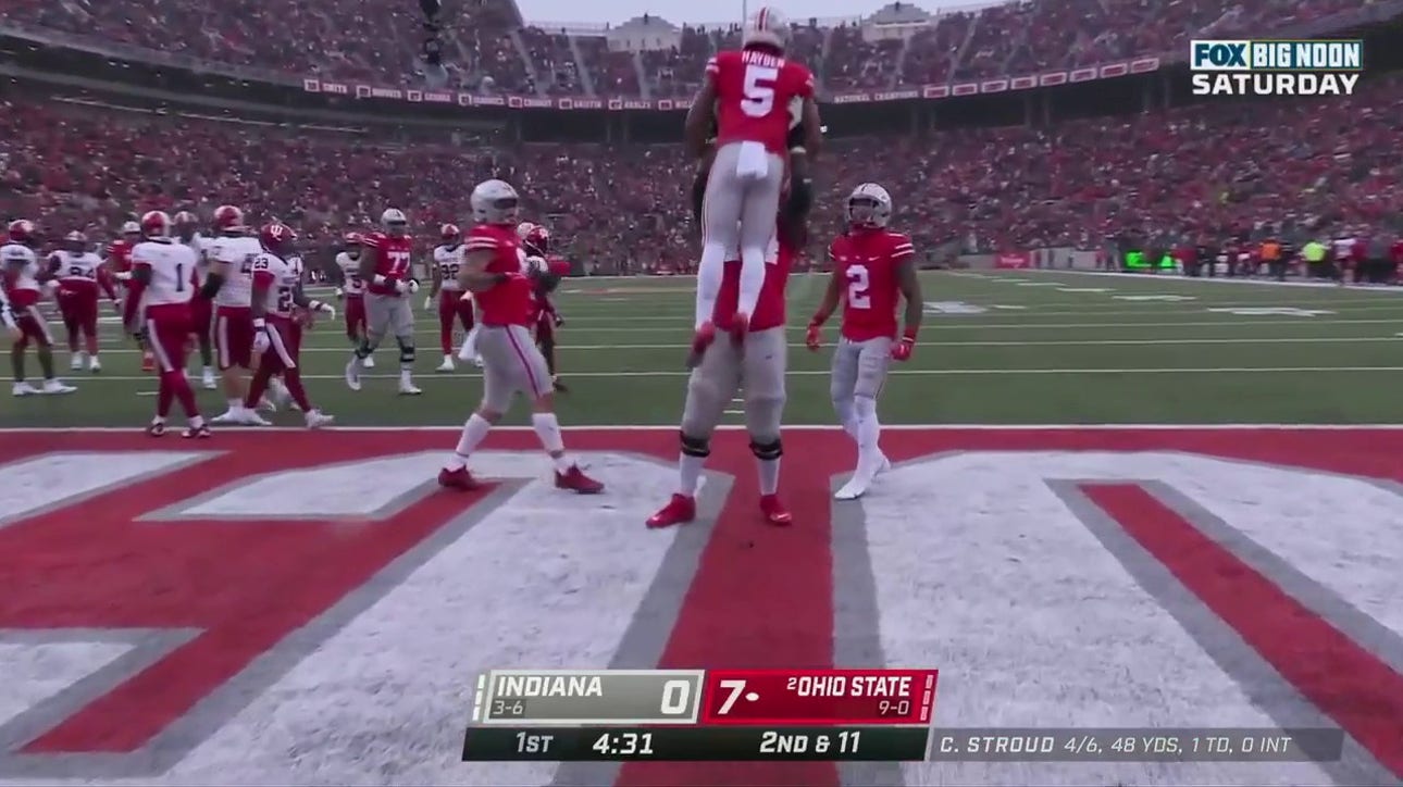 C.J. Stroud hands off to Dallan Hayden for a 14-yard touchdown extending the Ohio State lead 14-0