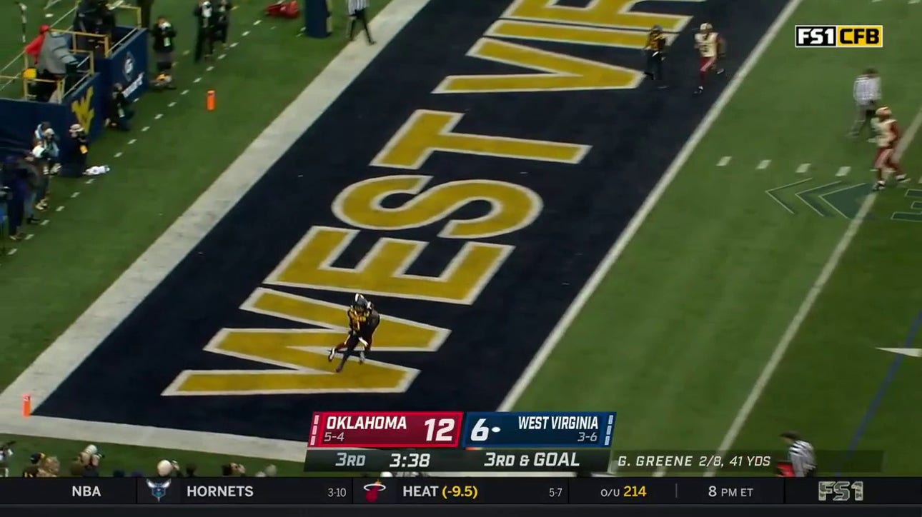 West Virginia's Garrett Greene connects with Bryce Ford-Wheaton for an eight-yard TD to take the lead against Oklahoma