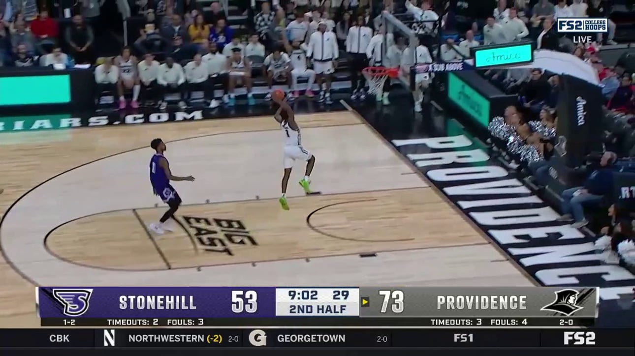 Providence's Jayden Pierre with the steal and fast-break dunk